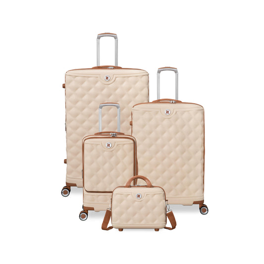 4 Piece Set of beige it luggage quilted suitcases with brown handles and wheels on a white background