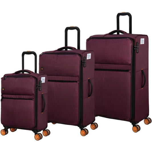 it luggage Set of three Dark Red suitcases with black handles and wheels on a white background